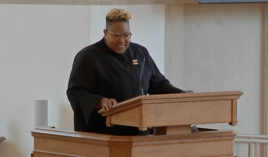 he Rev. Sheritta Williams preaching in Goodson Chapel in black robe