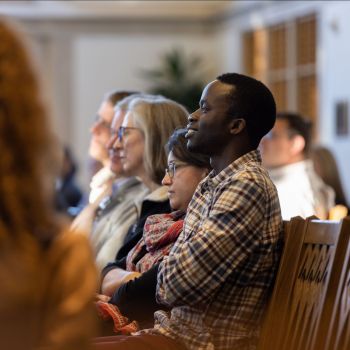 Students watch lecture in Goodson Chapel